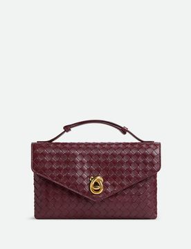 Mini Leather Handbag with Adjustable Features and Metallic Closure