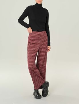 Pantalone palazzo in jersey a fantasia geometrica nera e fucsia
