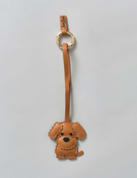 Portachiavi Bag Charm a forma di cagnolino in pelle cuoio con targa logo