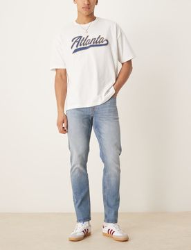Schmal geschnittene Jeans in mittelblauer Vintage-Waschung Blau 50 Long