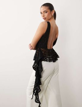 Top en dentelle avec ourlet à basque et volants - Noir XS