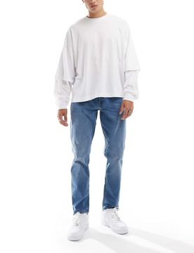 Adam - Schmal zulaufende Jeans in Mittelblau Blau W29 L32