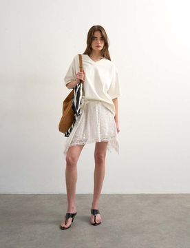 Mini-jupe à broderie anglaise avec ourlet mouchoir - Blanc 46