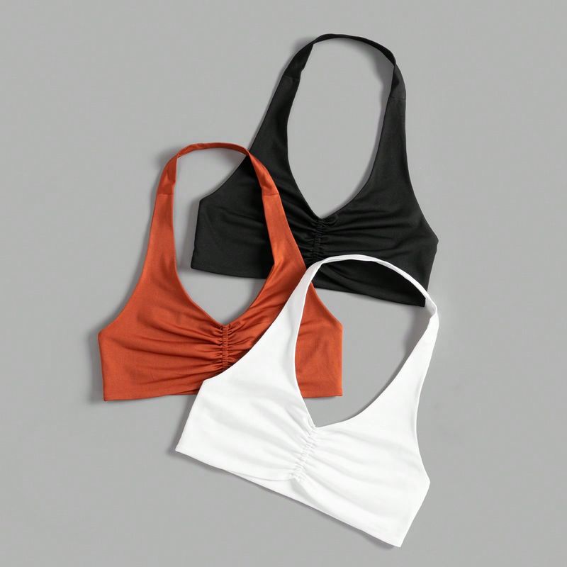 Top deportiva tipo cami con corte con gráfico en la espalda